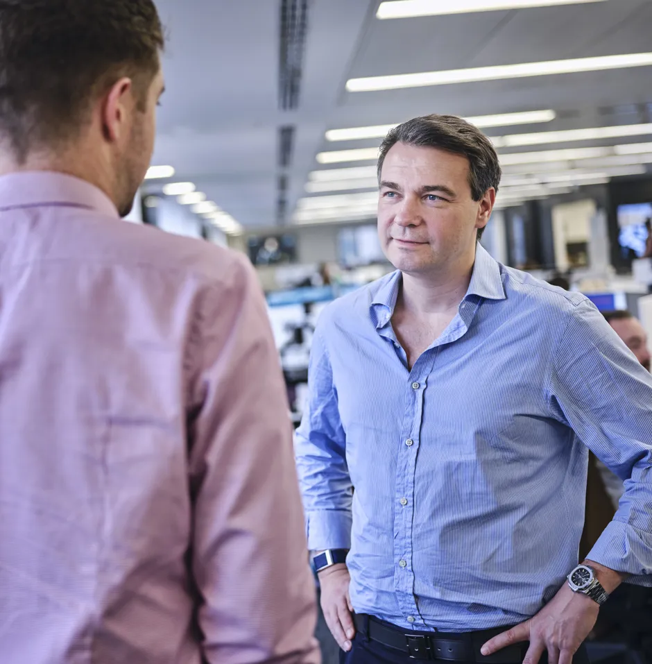 Two men talking in an office