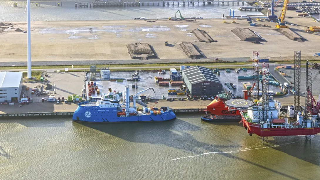 Aerial view of a harbor with vessels and equipment.