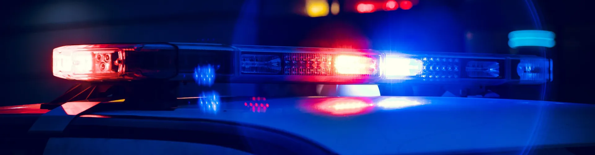 Closeup of Police Lights on Dark Street at Night