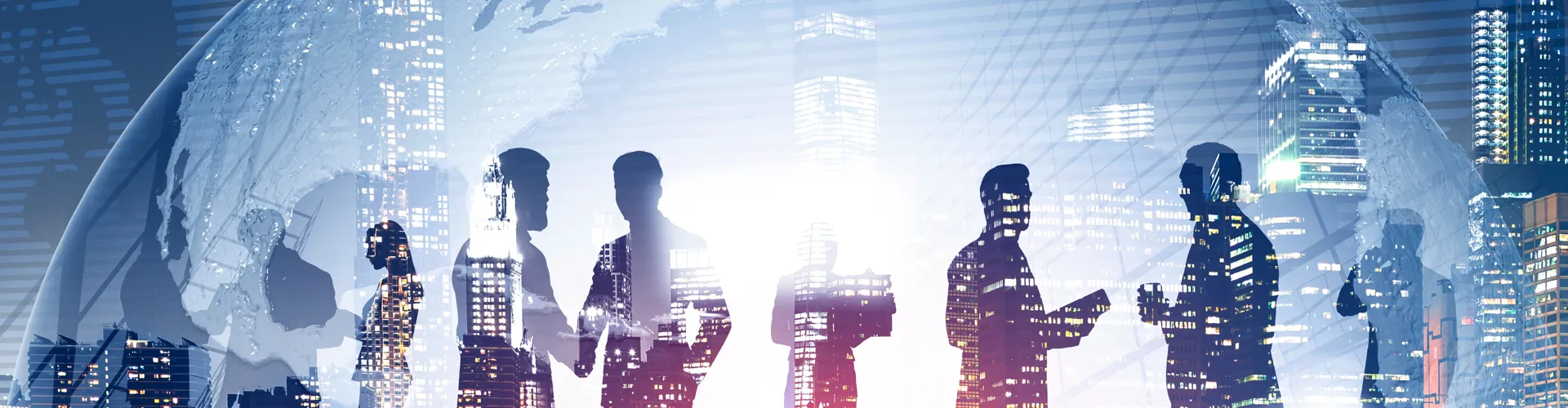 Silhouettes of businesspeople against a city backdrop.