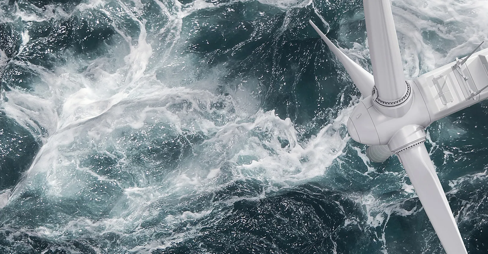 Aerial panorama of a close up wind turbine in the sea