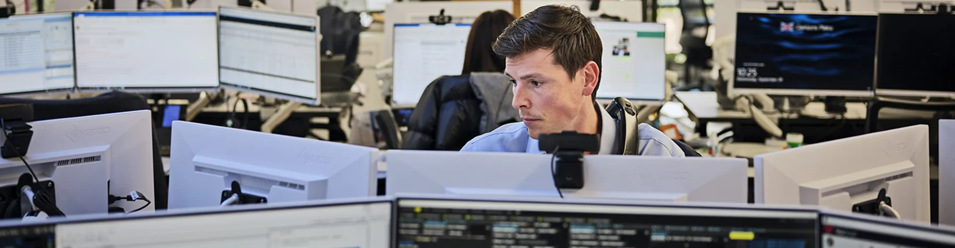 broker looking at his computer screens