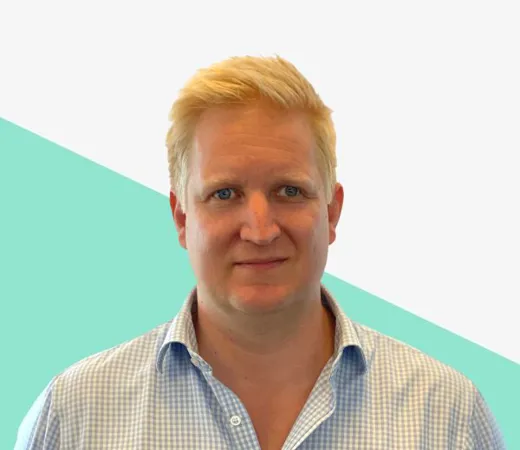 Man with blond hair in a blue checkered shirt.