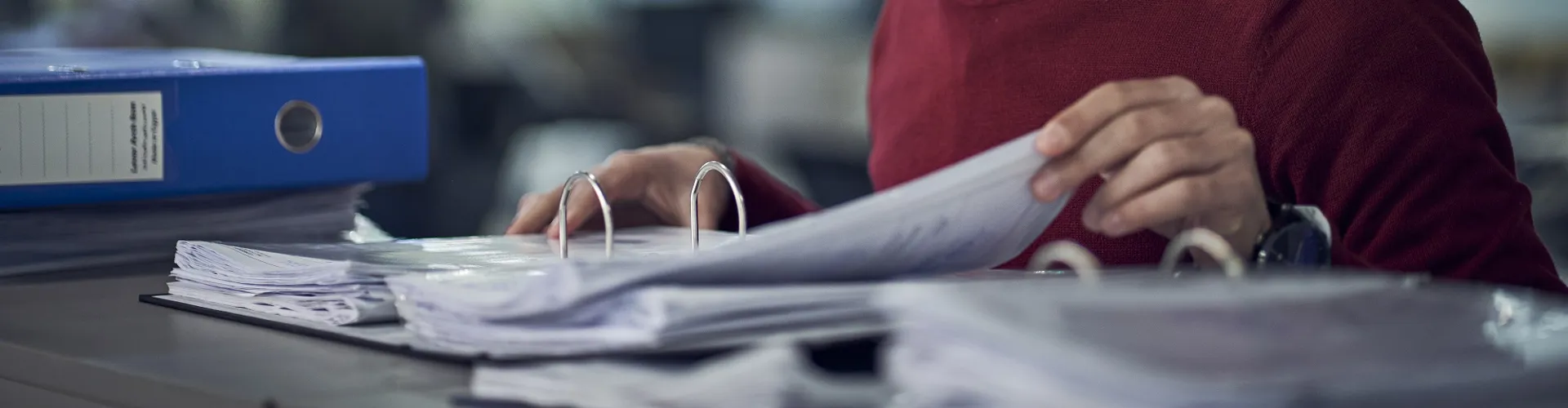 man standing looking at a file