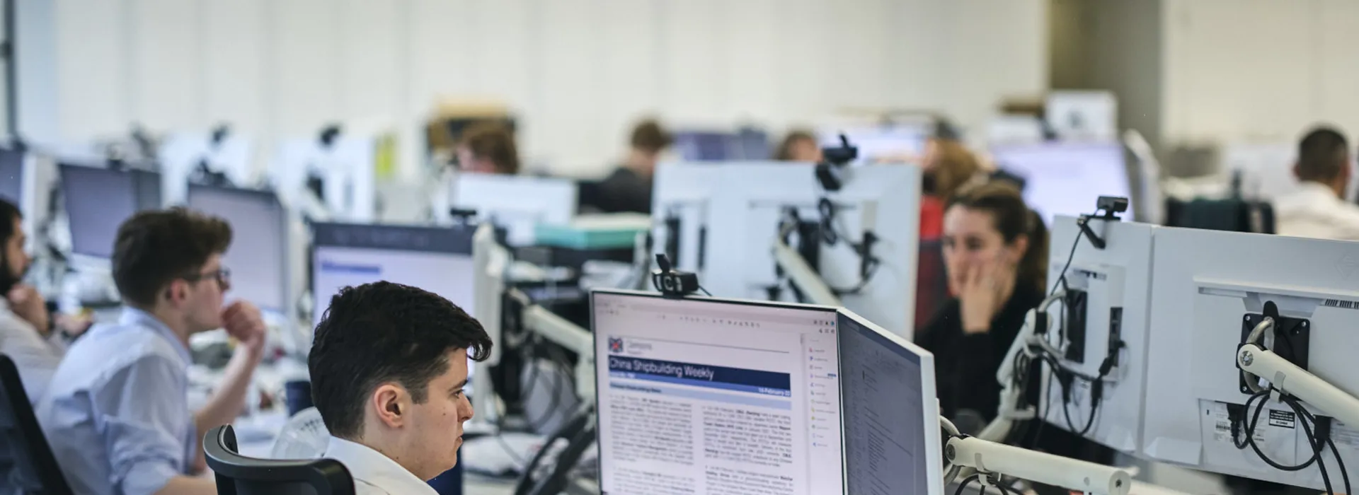 room of employees working of their computers