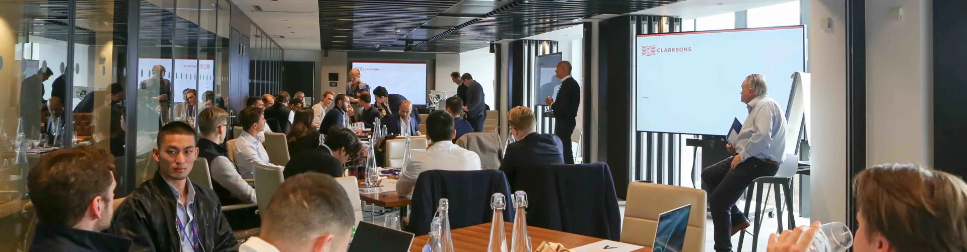 Group meeting in a modern conference room.