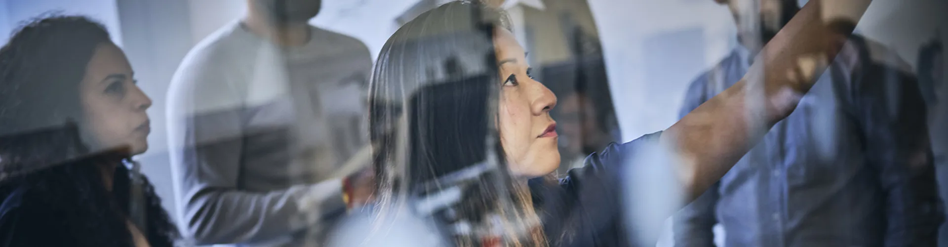 colleagues in a meeting room discussing new ideas and brainstorming