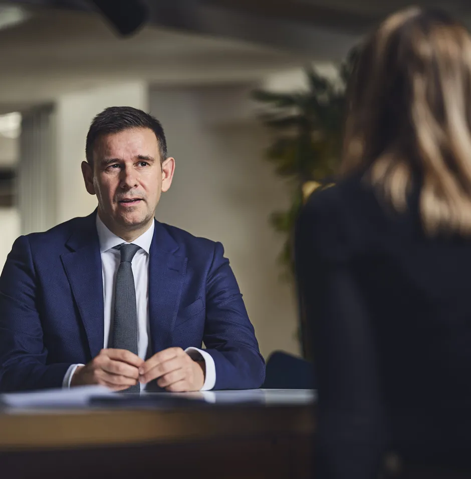 man talking to someone across a table