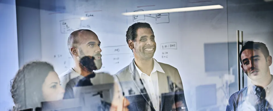 Colleagues in a meeting discussing new ideas