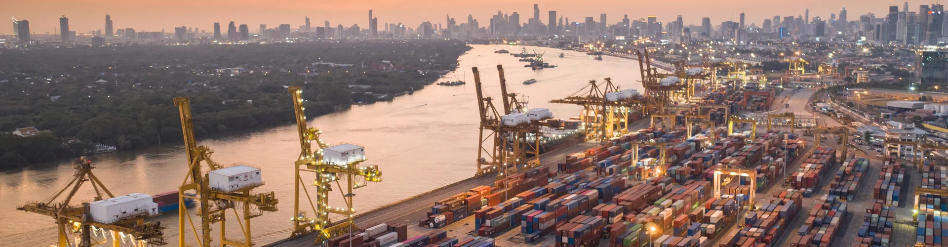 Sunset evening port shipping. Logistics and transportation of Container Cargo ship and Cargo plane with working 